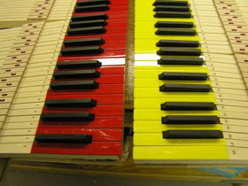 yellow and red colored piano keytops